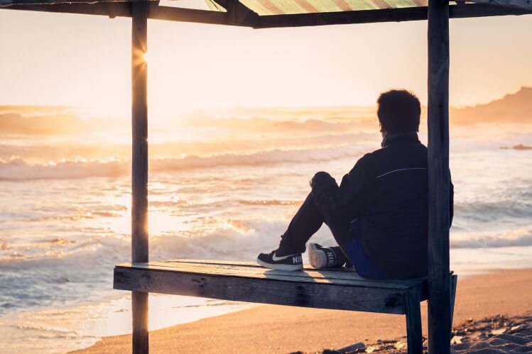 sitting on a bench mental health rehab and addiction