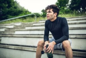 man is sitting on stairs having a brake general anxiety disorder substance use disorder rehab