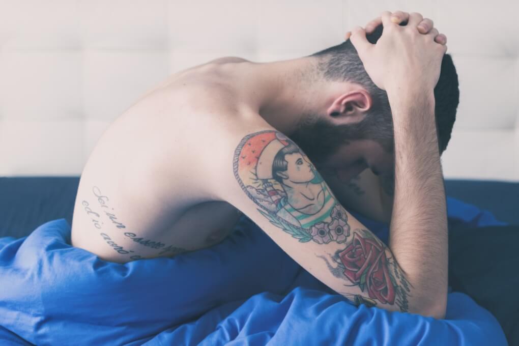 Meth addiction treatment california man hands behind neck bed