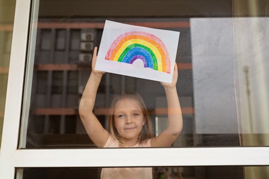 little girl with blonde hair having fun at home during coronavirus pandemic mental health children helping
